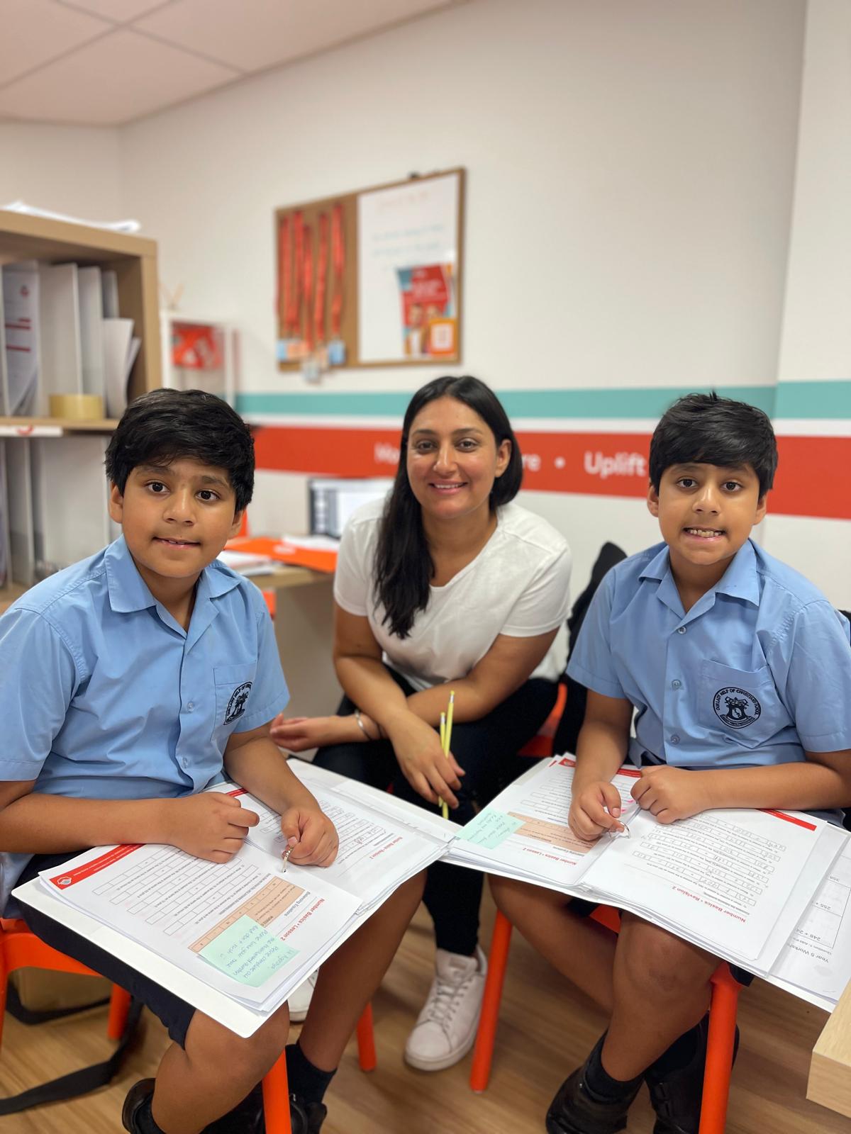 Tutor helping students